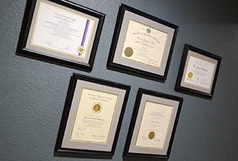 Certificates hanging on wall