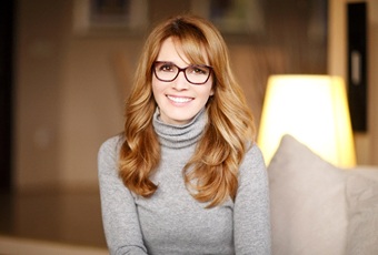 Youthful woman with glasses smiling
