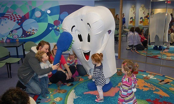 Pearl E. White playing with kids