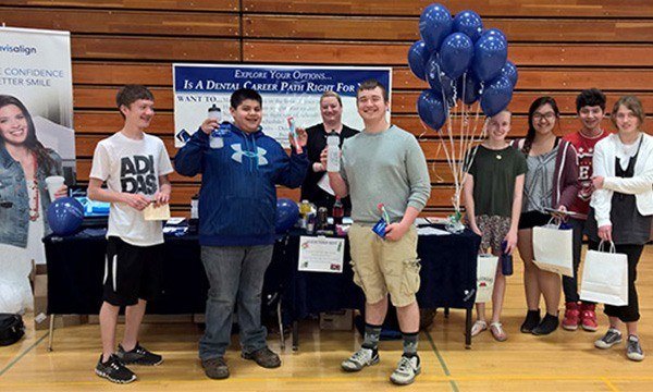 Students visiting table at career fair