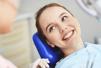 Young woman smiling in dental chair