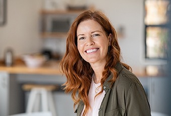 Red haired mature woman smiling 