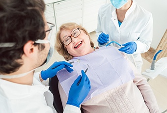 Woman smiling at dental team during treatment