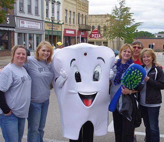 Team members posing with Pearl E. White