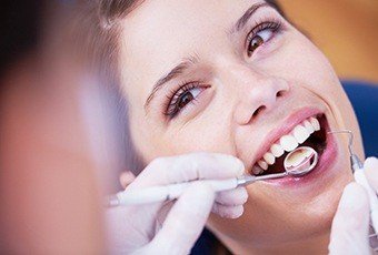 Woman receiving dental exam