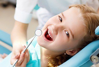 Young girl in dental chair