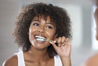 Woman brushing teeth