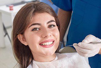 Woman in dental chair smiling