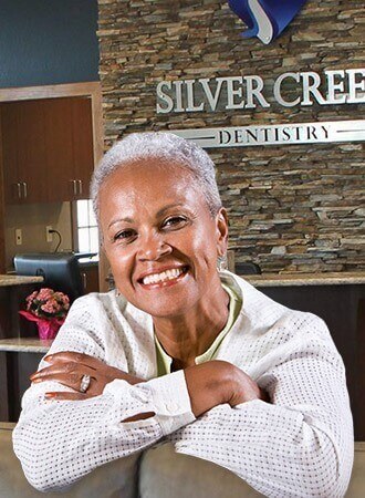 Senior woman smiling in waiting area