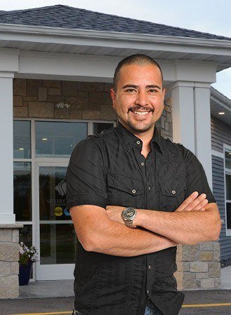 Smiling man outside of office