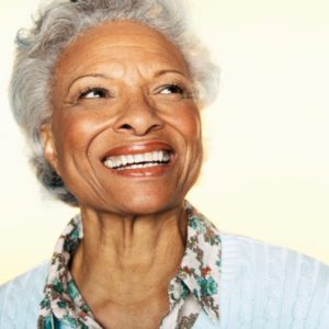 senior woman with a beautiful smile thanks to the dental implants ripon residents rely on