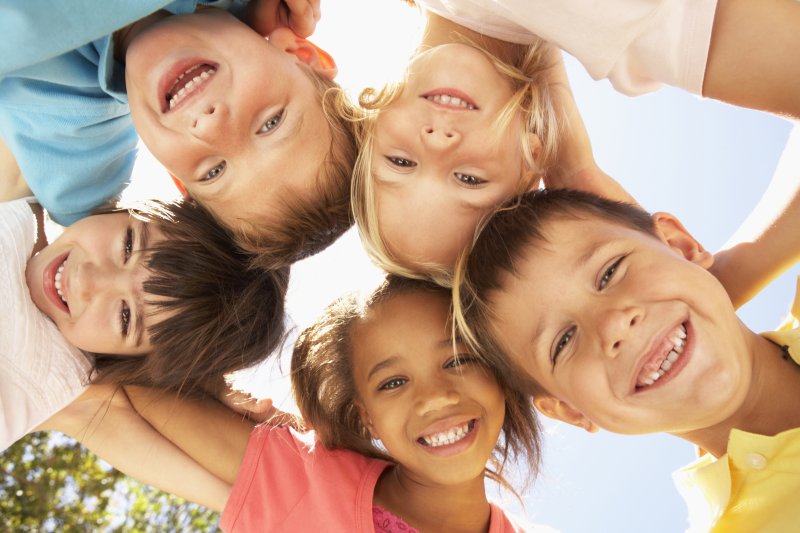 A group of children smiling.