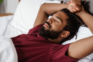 a person relaxing in their bed