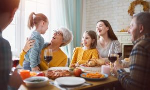 woman enjoying family dinner