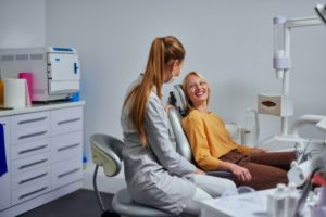 woman talking with her dentist 