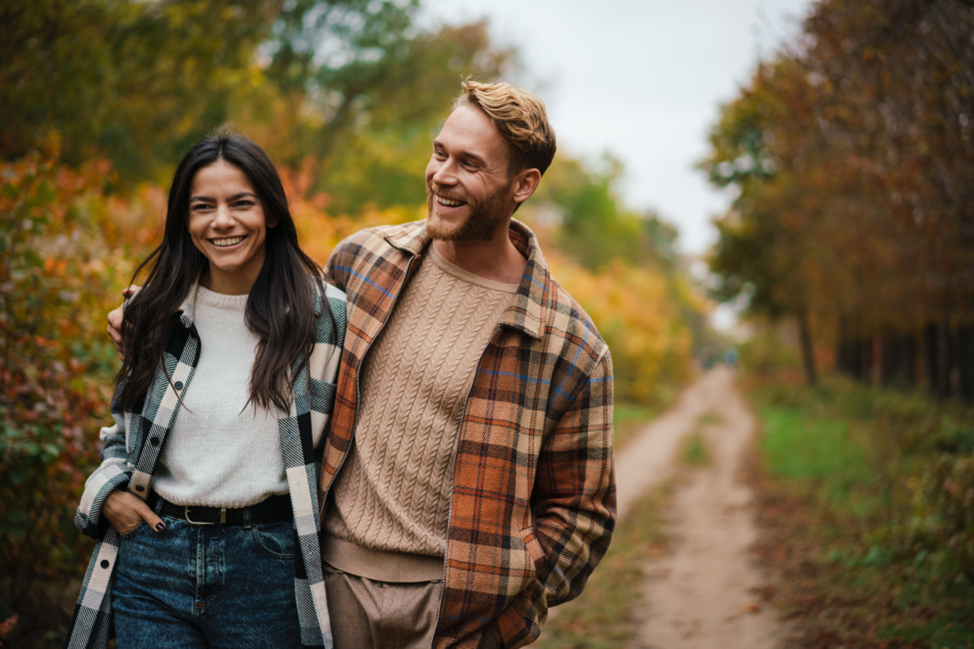 young happy couple walking outdoors
